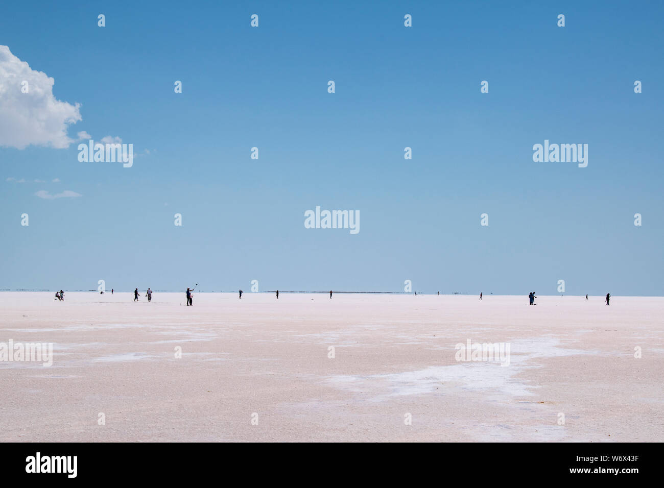 Turkey: people in the distance walking on the salt expanse of Lake Tuz, Tuz Golu, the Salt Lake, one of the largest hypersaline lakes in the world Stock Photo