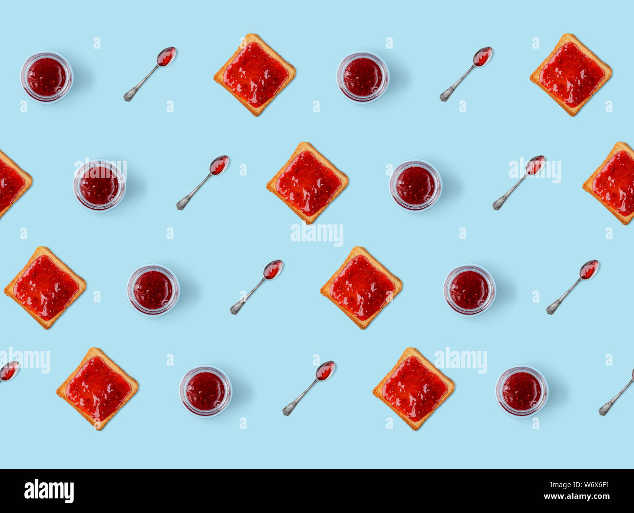 Toasts, jars of jam, spoons Stock Photo Alamy