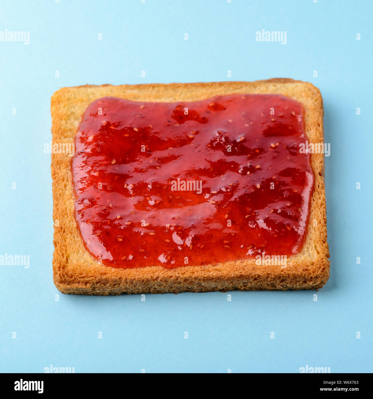 Toast with raspberry jam Stock Photo