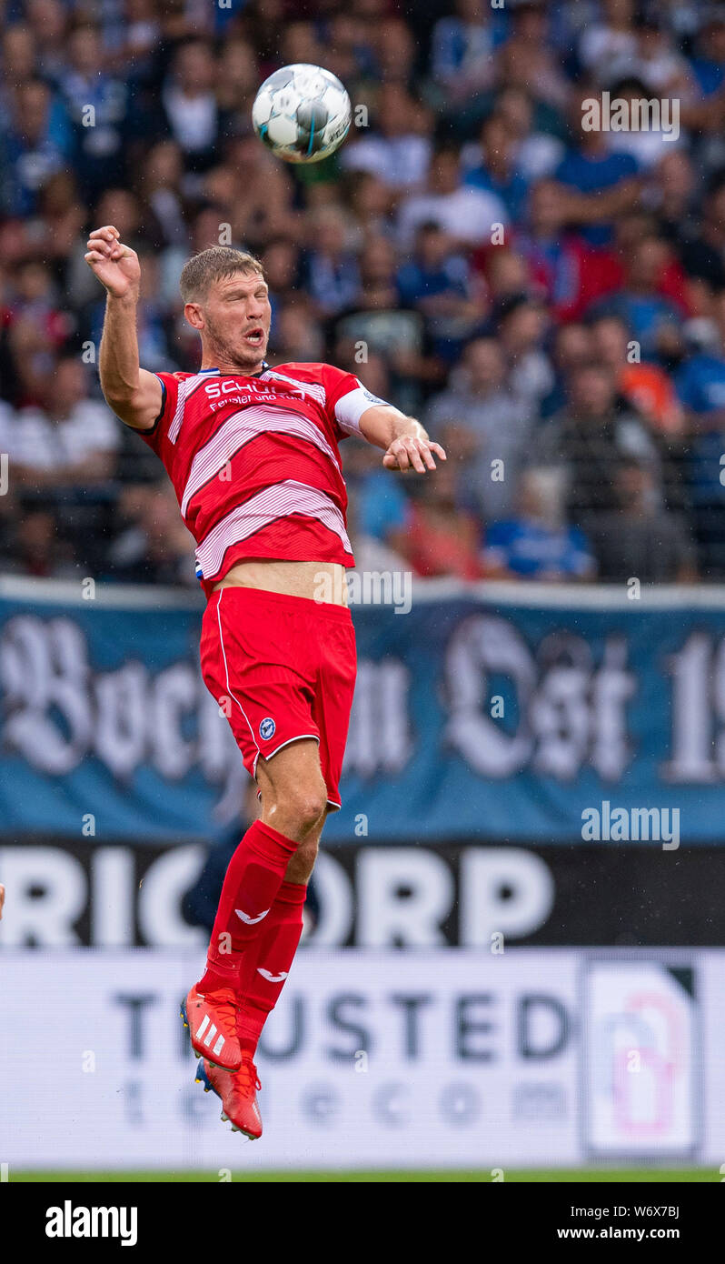 Bochum, Germany. 02nd Aug, 2019. Soccer: 2nd Bundesliga, VfL Bochum - Arminia Bielefeld, 2nd matchday in the Vonovia Ruhrstadion. Bielefeld's Fabian Klos at the header. Credit: Guido Kirchner/dpa - IMPORTANT NOTE: In accordance with the requirements of the DFL Deutsche Fußball Liga or the DFB Deutscher Fußball-Bund, it is prohibited to use or have used photographs taken in the stadium and/or the match in the form of sequence images and/or video-like photo sequences./dpa/Alamy Live News Stock Photo