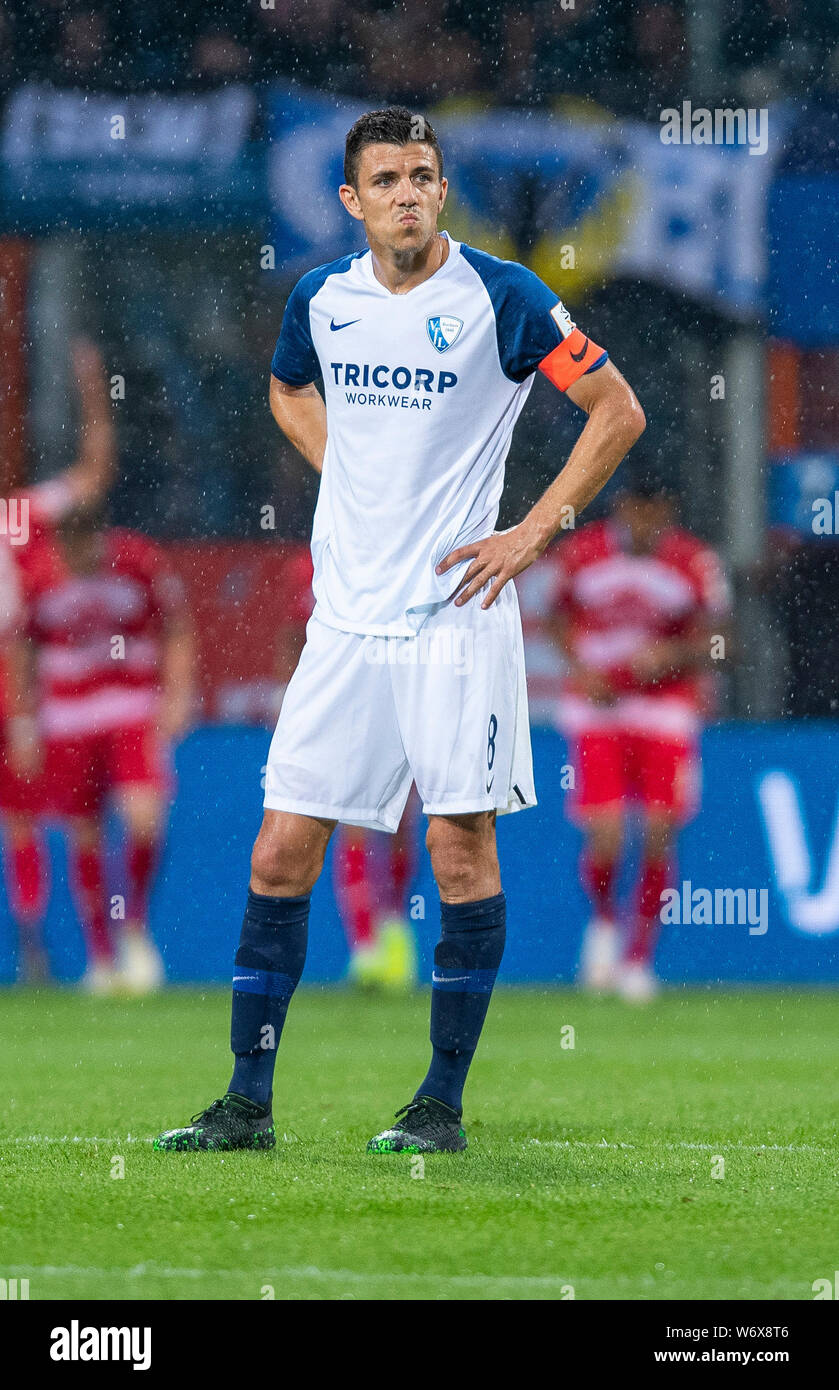 Bochum, Germany. 02nd Aug, 2019. Soccer: 2nd Bundesliga, VfL Bochum - Arminia Bielefeld, 2nd matchday in the Vonovia Ruhrstadion. Bochum's Anthony Losilla stands after the goal of the Bielefelder on the square. Credit: Guido Kirchner/dpa - IMPORTANT NOTE: In accordance with the requirements of the DFL Deutsche Fußball Liga or the DFB Deutscher Fußball-Bund, it is prohibited to use or have used photographs taken in the stadium and/or the match in the form of sequence images and/or video-like photo sequences./dpa/Alamy Live News Stock Photo