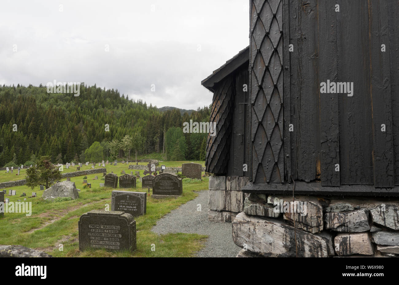 Eidsborg Stave church from the medieval period, a prime example of Norwegian wooden architecture and a tourist attraction, newly tar painted Stock Photo