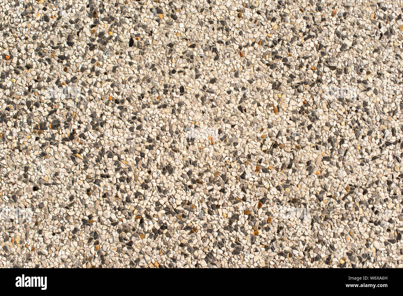 Little pebbles texture, walkway surface, textured background. Stock Photo