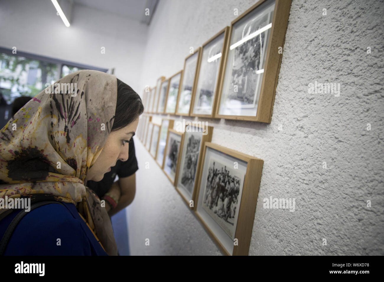 August 2, 2019, Tehran, Tehran, IRAN: People visit Iranian former AP photographer, Mohammad Sayad's exhibit at the Nabshi Gallery in Tehran, Iran. (Credit Image: © Rouzbeh Fouladi/ZUMA Wire) Stock Photo