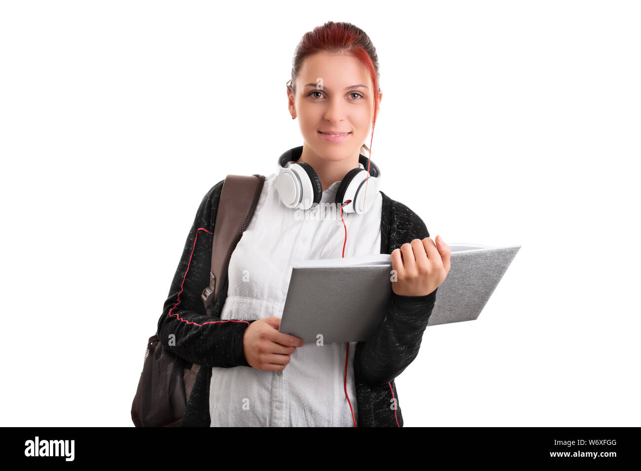 Beautiful smiling student with backpack, headphones and an open book ...