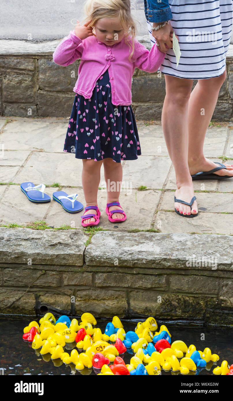 Baby wearing crocs deals