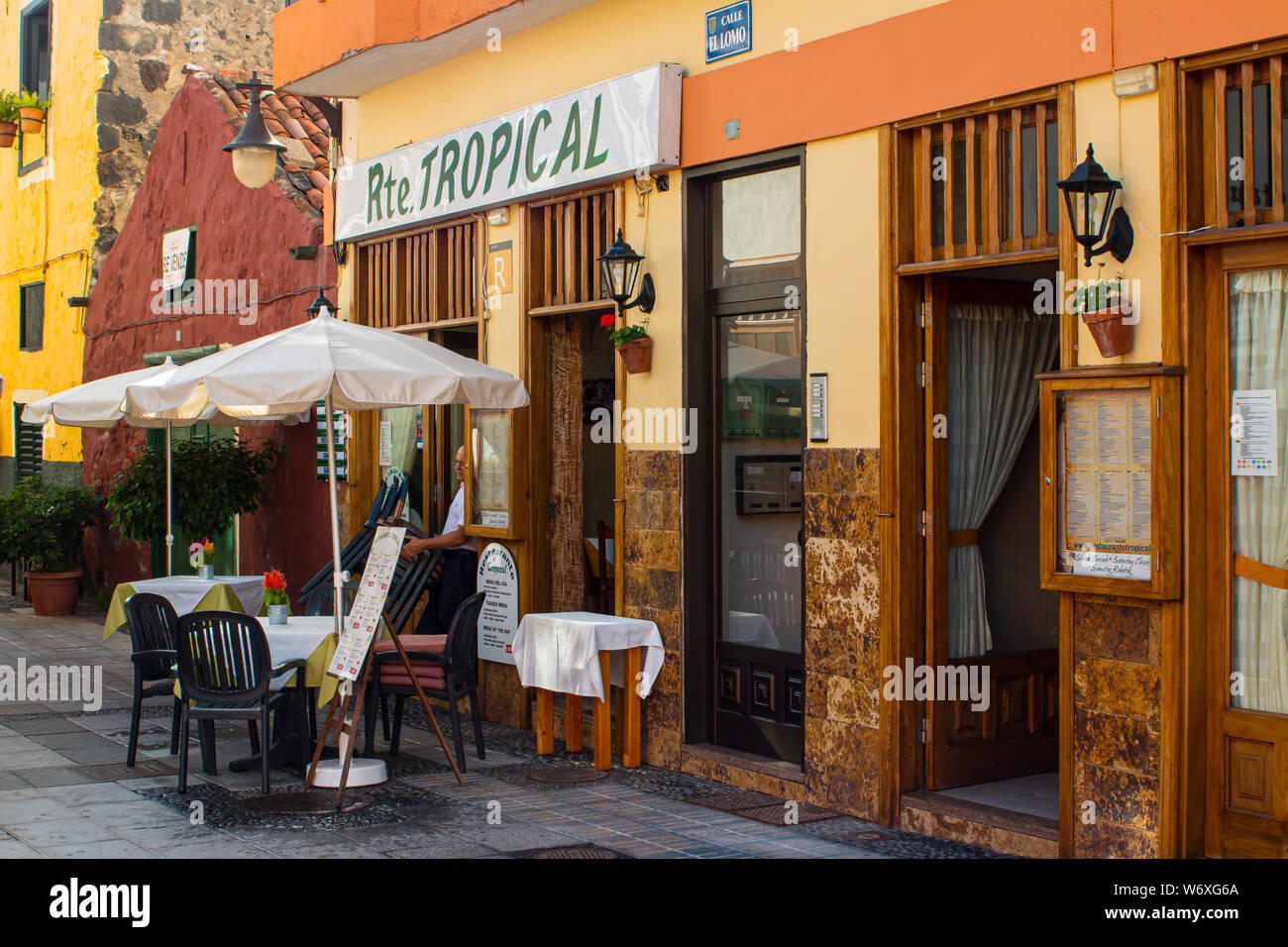 Restaurant on the Spanish Island of Tenerife. The owner is getting ready for the day's service. Stock Photo