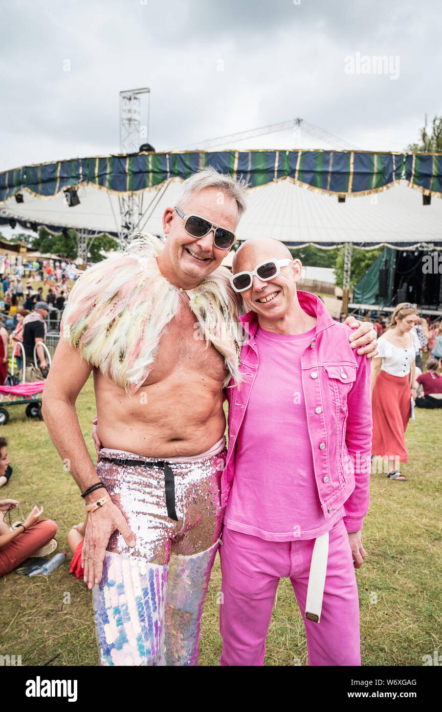Cornbury Park, Oxfordshire, UK. Saturday 3rd August 2019. Wilderness Festival, Oxfordshire, UK.  L-R: James and Adrian from London. Revellers dressed up as Wilderness gets into full swing. Now in its 9th year, the festival is a celebration of art, music, fashion and culture on Cornbury Estate near Chipping Norton. Picture: Andrew Walmsley/Alamy Live News Stock Photo