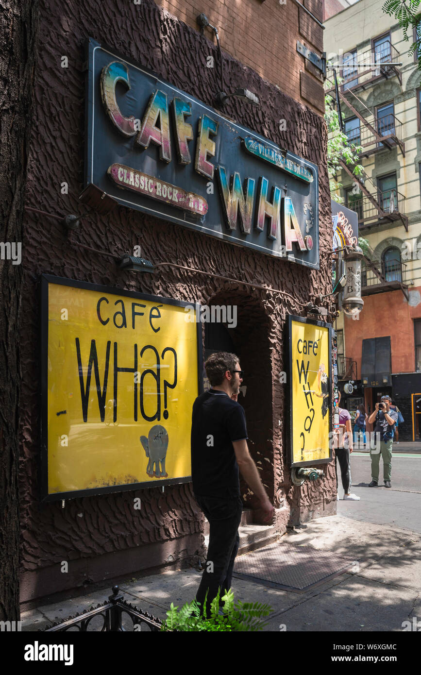 Cafe Wha? New York, view of the Cafe Wha? signs on the corner of MacDougal St. and Minetta Lane in the center of Greenwich Village, New York City, USA. Stock Photo