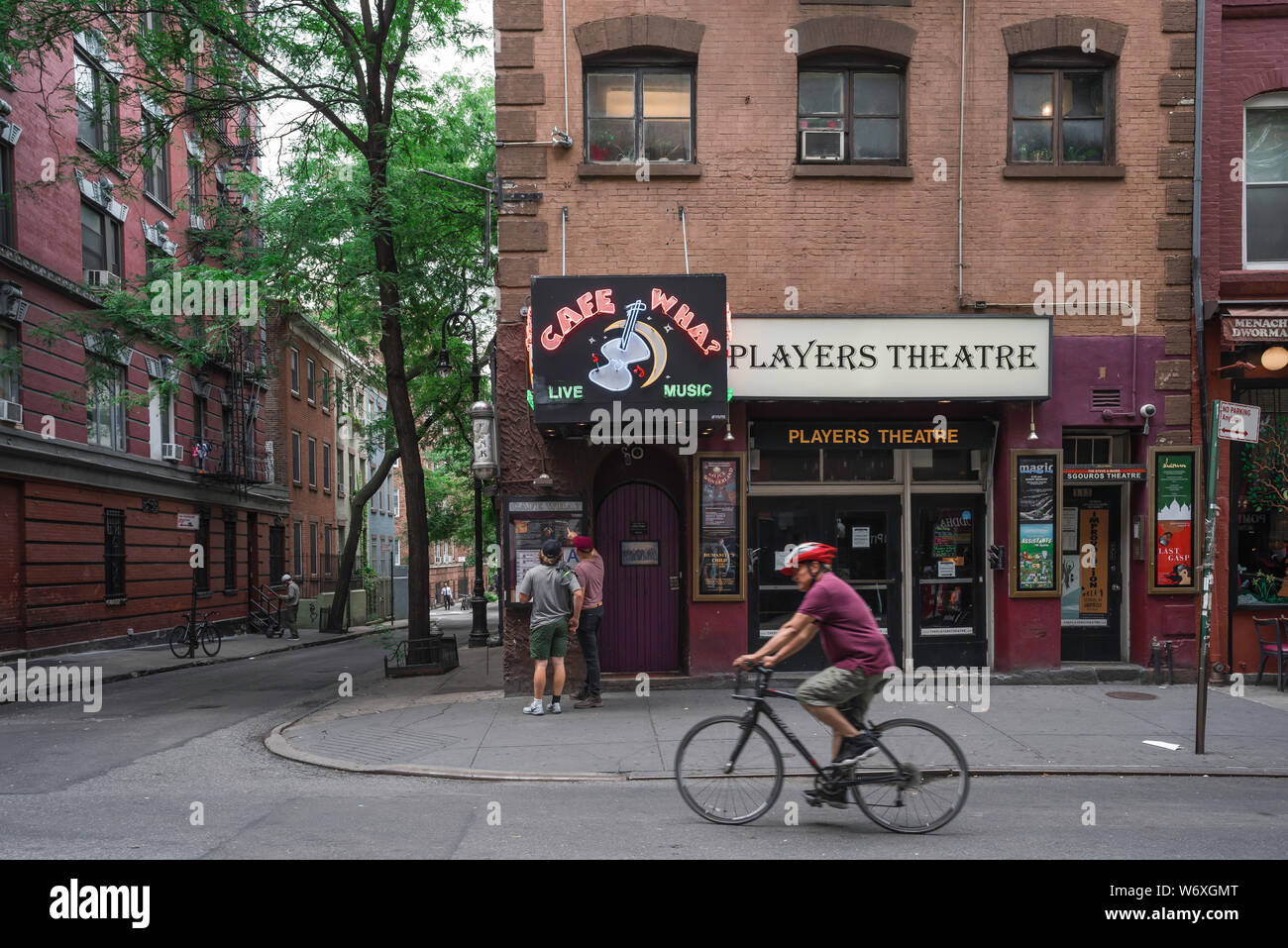 West Village street, view in summer of Cafe Wha? and The Players Theatre in MacDougal Street in the center of Greenwich Village, New York City, USA. Stock Photo