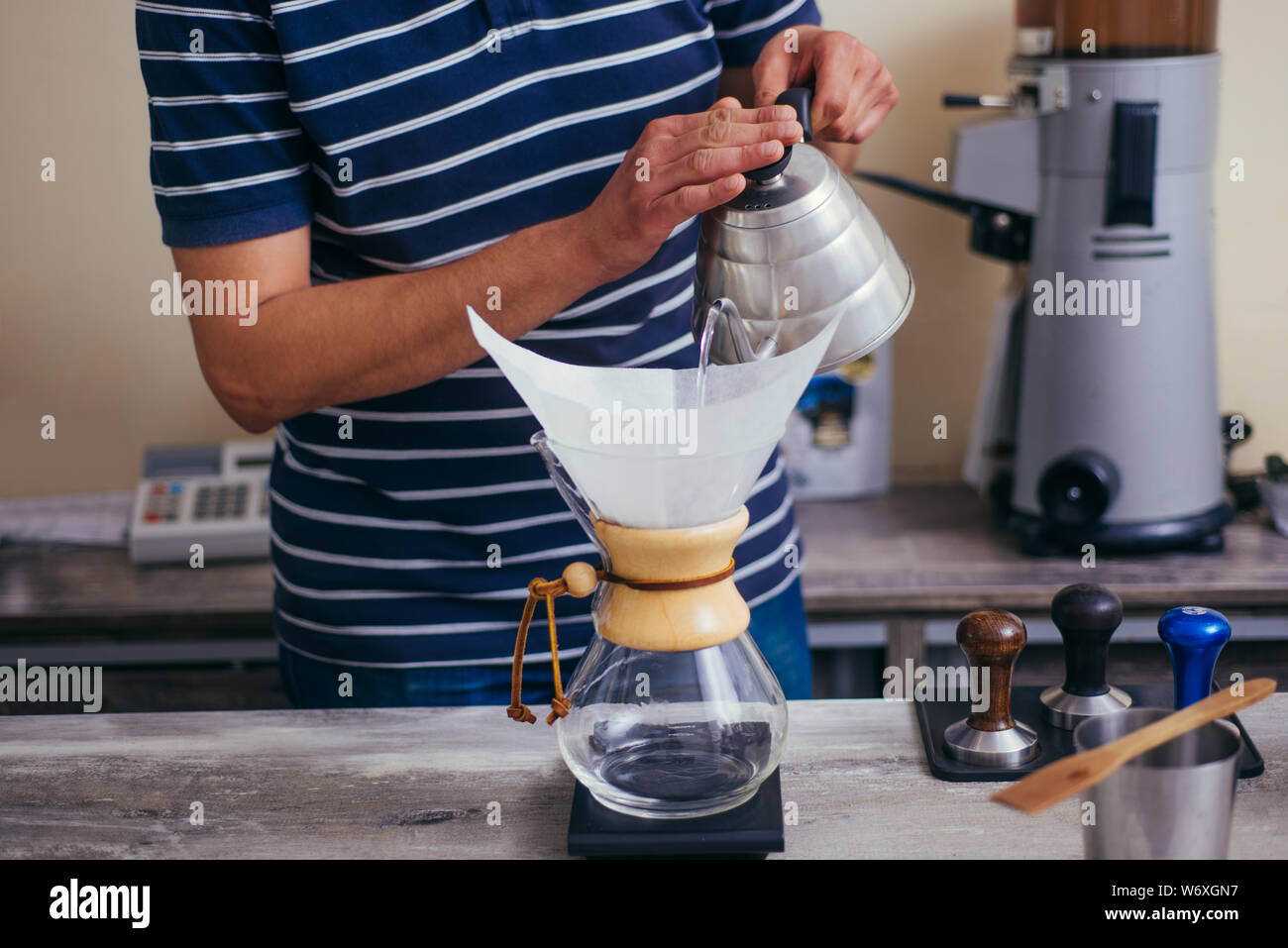 https://c8.alamy.com/comp/W6XGN7/making-hand-drip-coffee-by-paper-filter-in-coffee-shop-W6XGN7.jpg