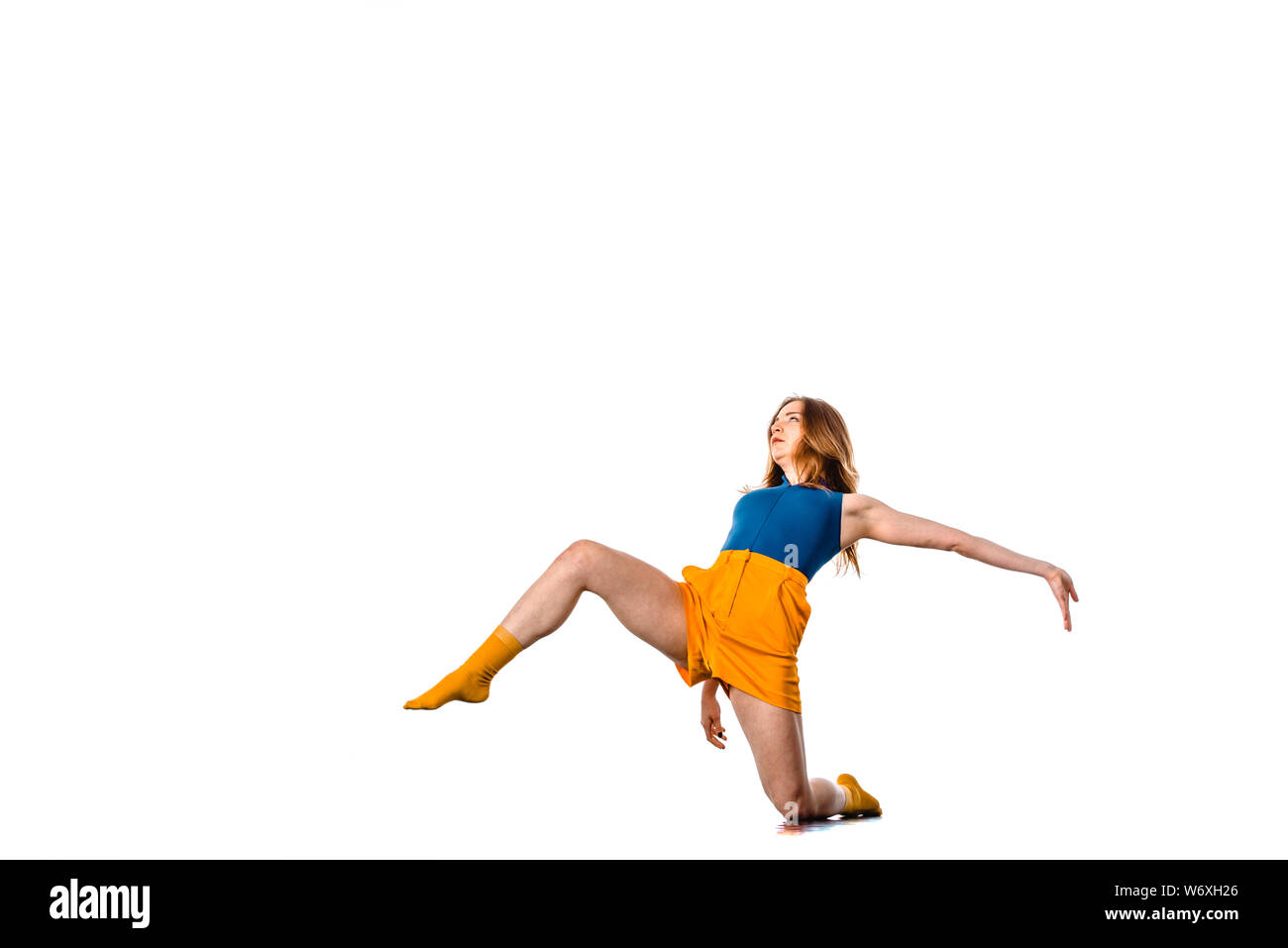 Amazing dancer is doing breakdance on a white background Stock Photo
