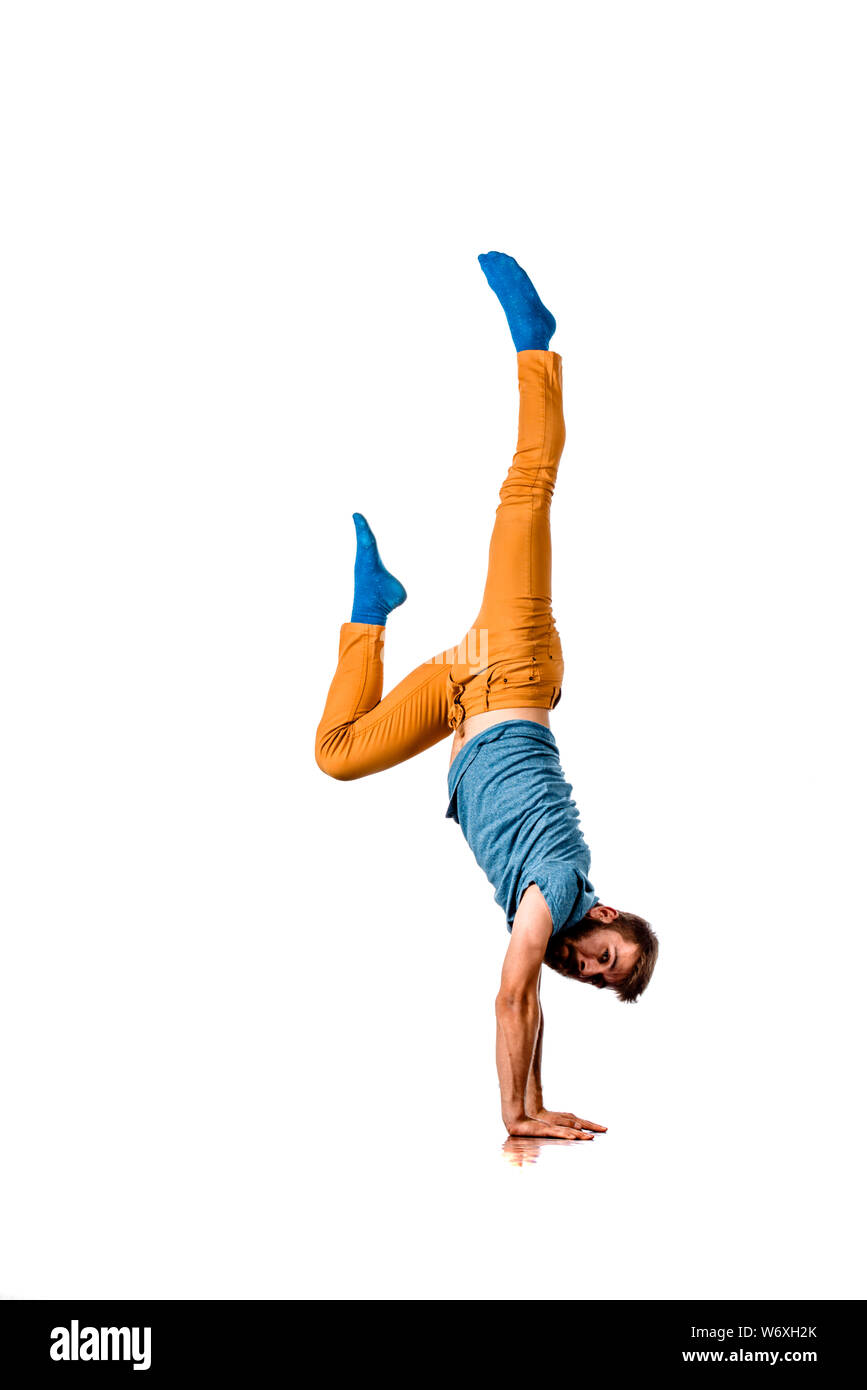Amazing dancer is doing breakdance on a white background Stock Photo