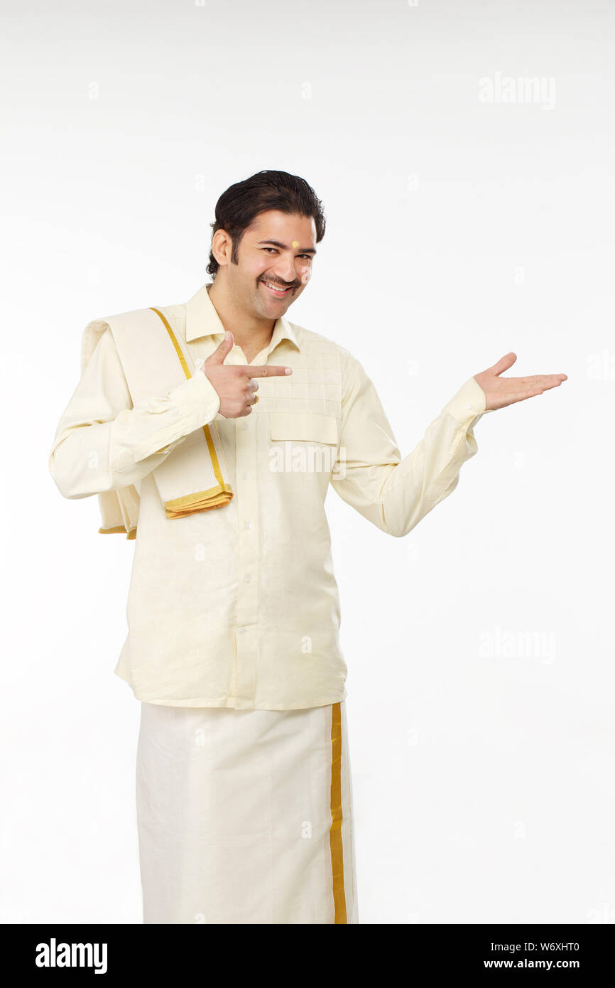 South Indian man smiling and gesturing Stock Photo - Alamy