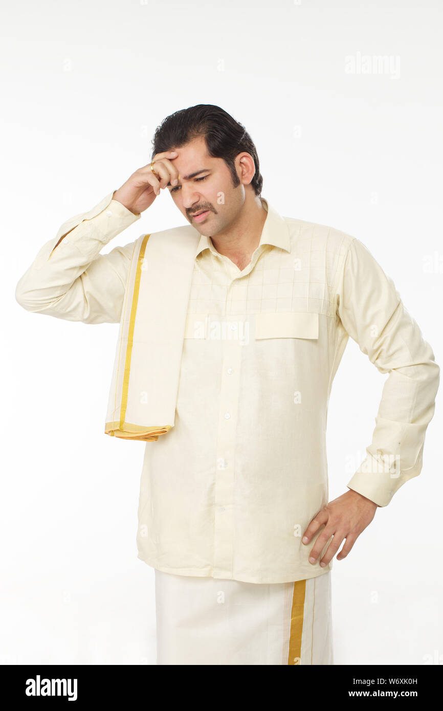 South Indian man suffering from headache Stock Photo - Alamy