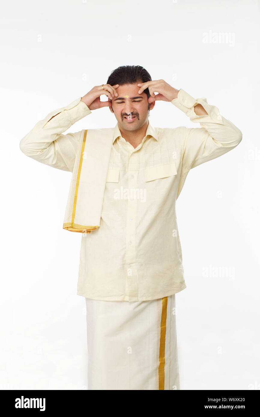 South Indian man suffering from headache Stock Photo - Alamy