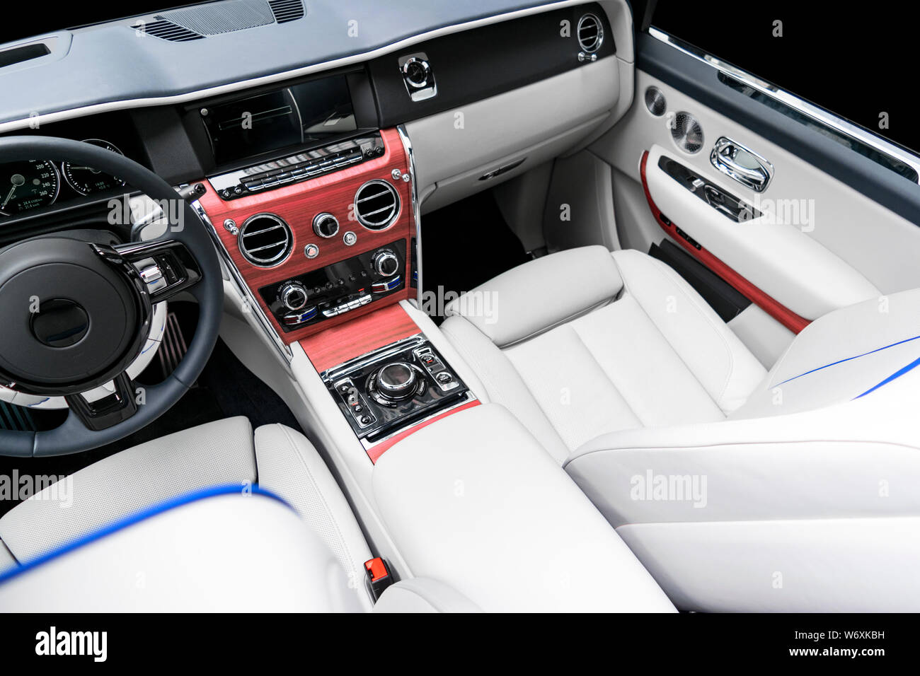 Modern luxury car white leather interior with natural wood panel. Part