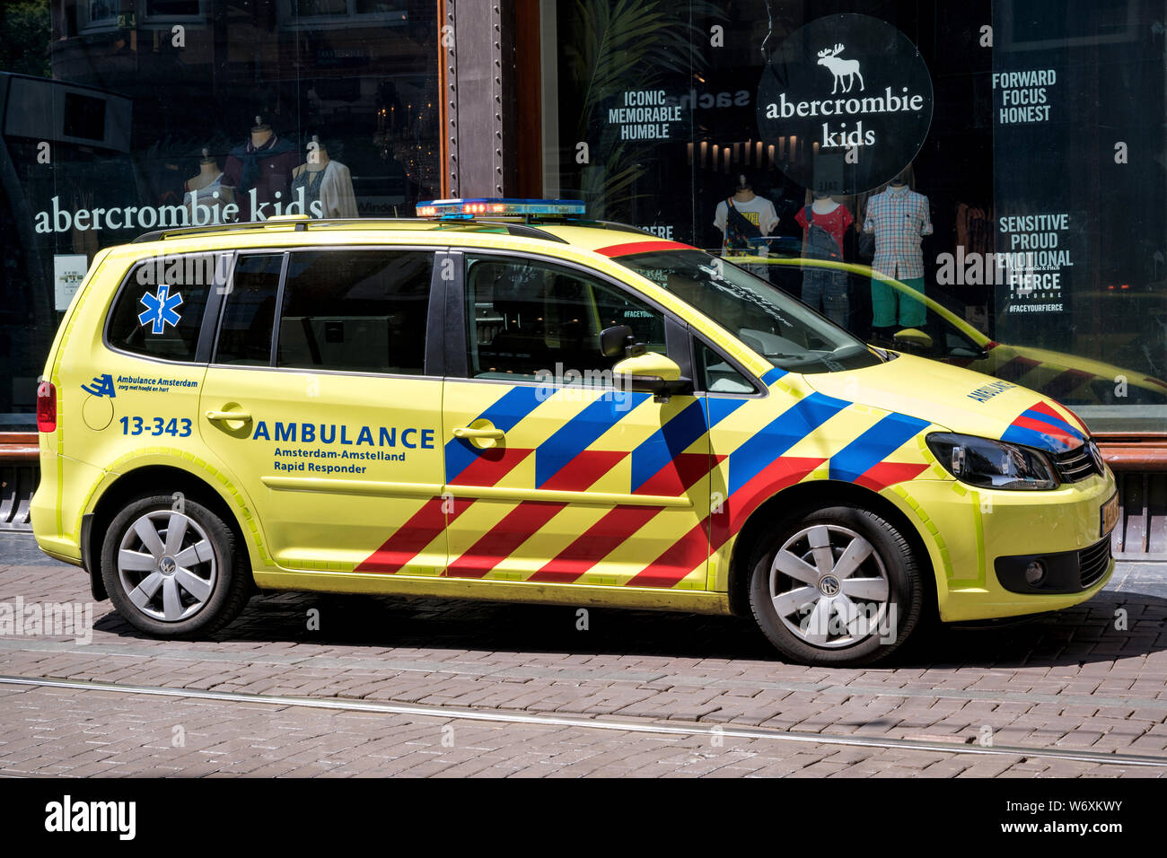 Dutch ambulance Volkswagen Touran in the city of Amsterdam Stock Photo