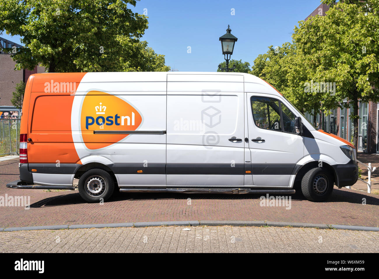 PostNL delivery van. PostNL is a mail, parcel and e-commerce corporation with operations in the Netherlands, Germany, Italy, Belgium, and the U. Stock Photo