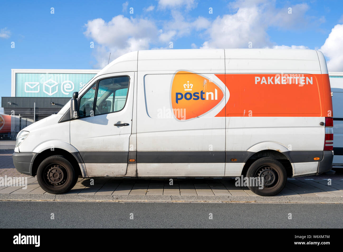 PostNL delivery van. PostNL is a mail, parcel and e-commerce corporation with operations in the Netherlands, Germany, Italy, Belgium, and the UK. Stock Photo