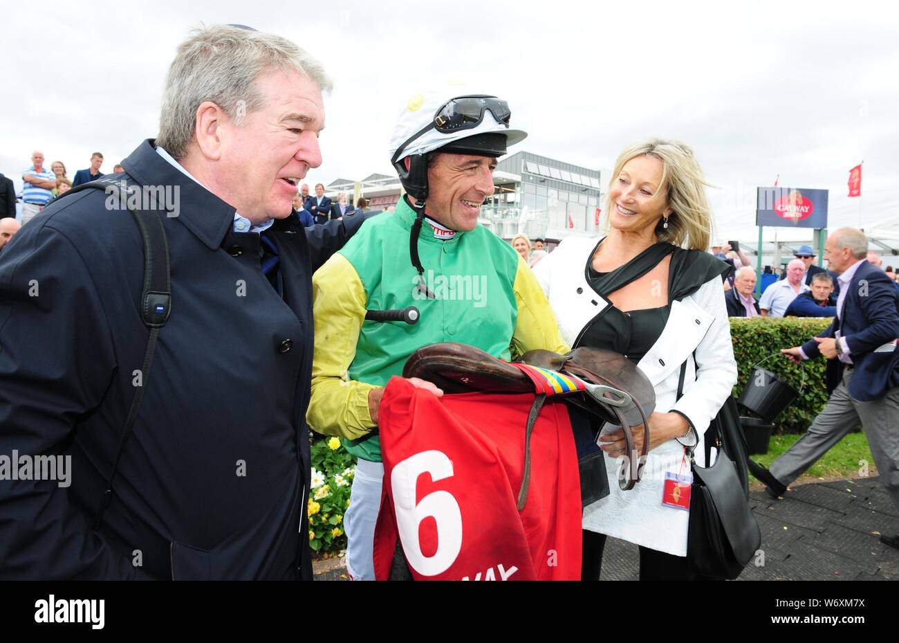 Jockey Davy Russell with owners John & Debbie Breslin after winning the O'Leary Insurances Maiden Hurdle onboard Mr Everest during day six of the 2019 Summer Festival at Galway Racecourse. Stock Photo