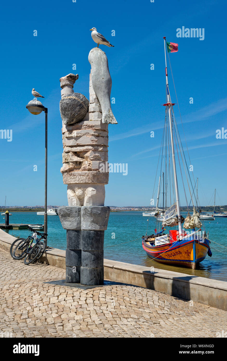modern sculpture of a fisherman by Joao Cutileiro, on Alvor habour front, the Algarve, Portugal Stock Photo
