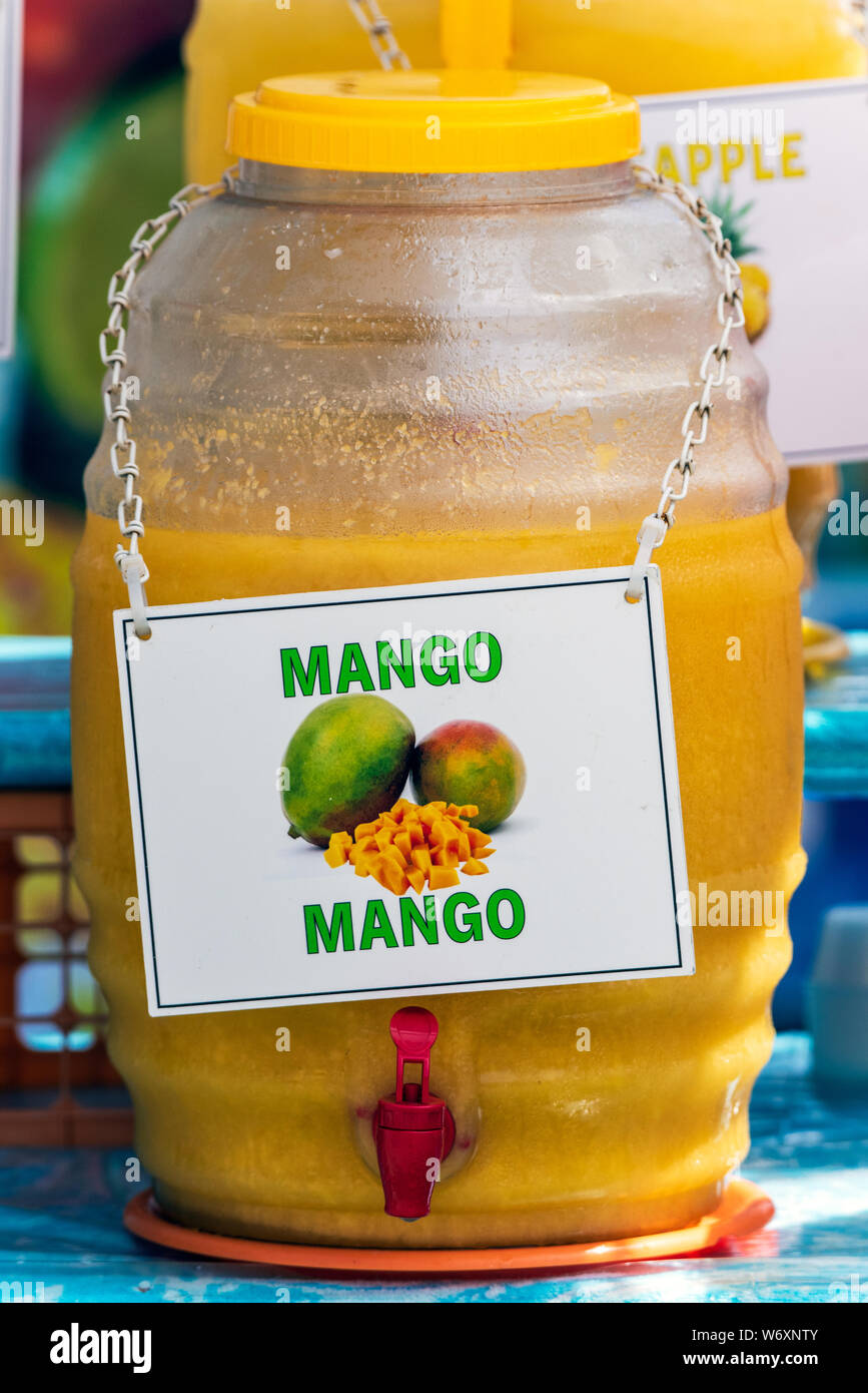 Sweet mango fruit punch displayed in dispenser tempts the potential