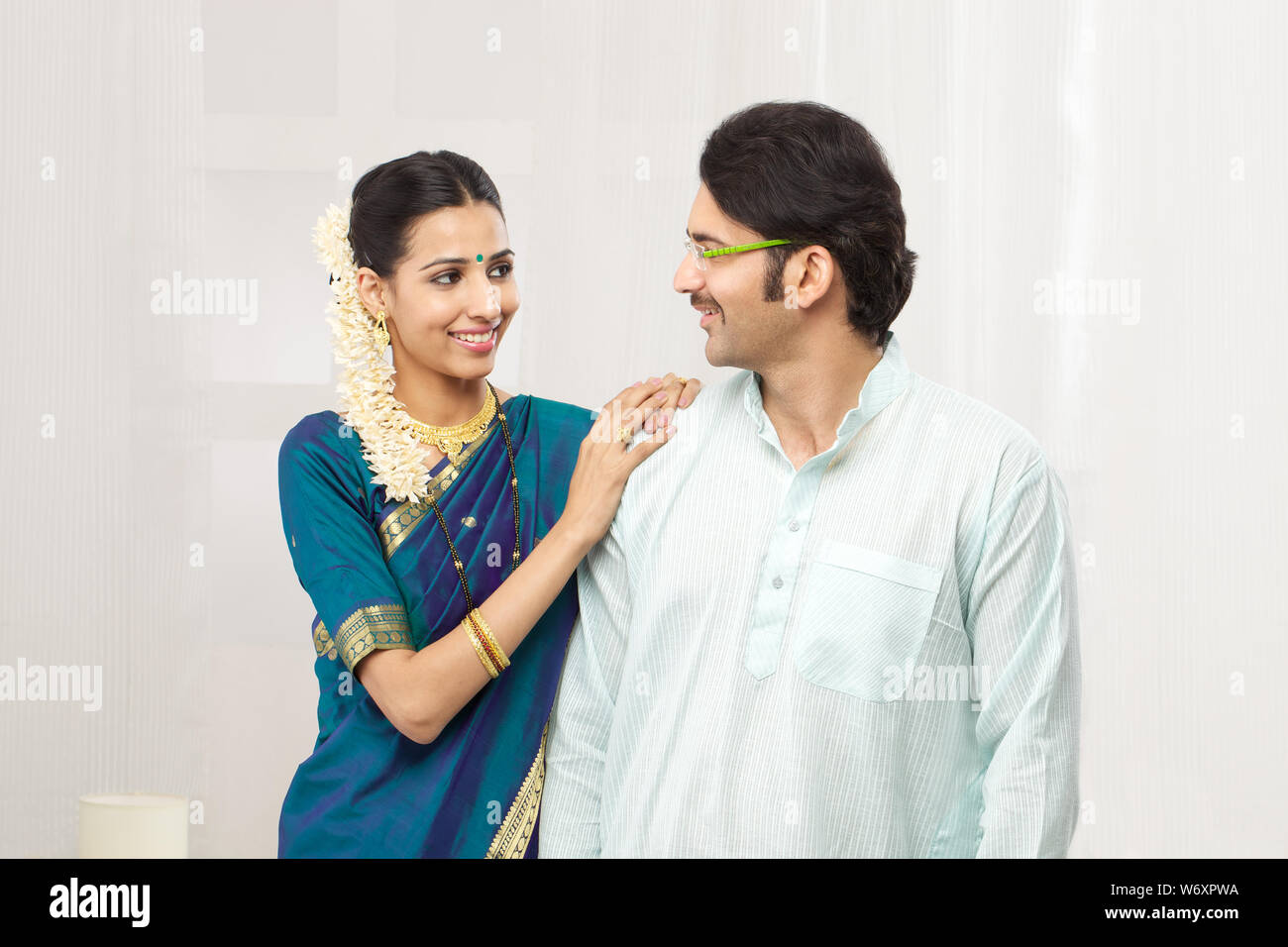 South Indian couple looking at each other and smiling Stock Photo - Alamy