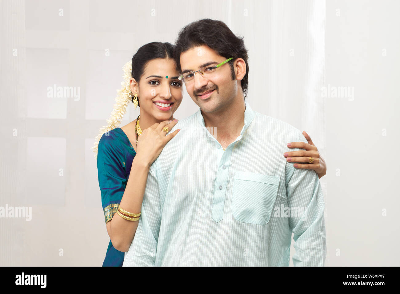South Indian couple standing together Stock Photo - Alamy