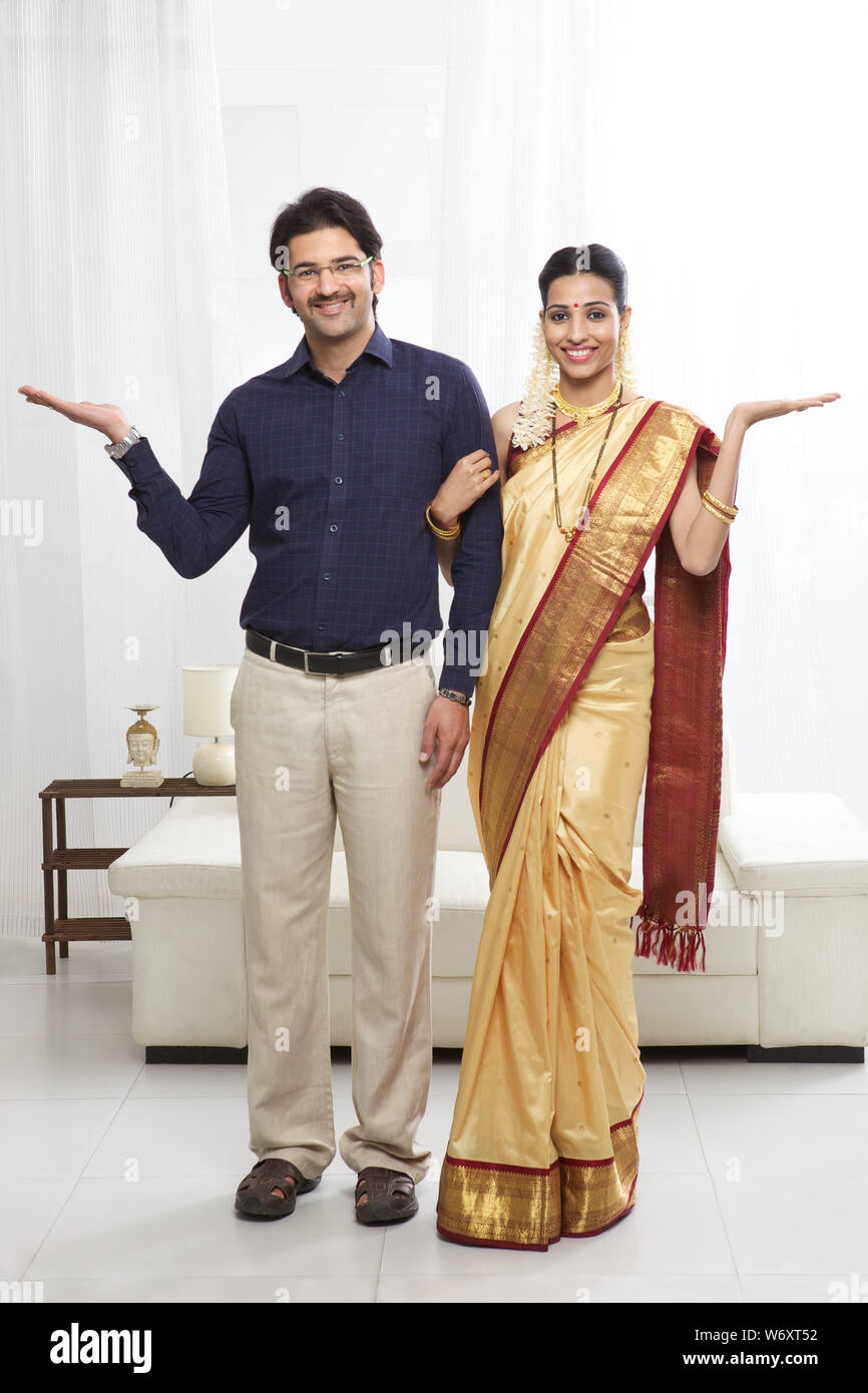 South Indian couple standing together and gesturing Stock Photo - Alamy