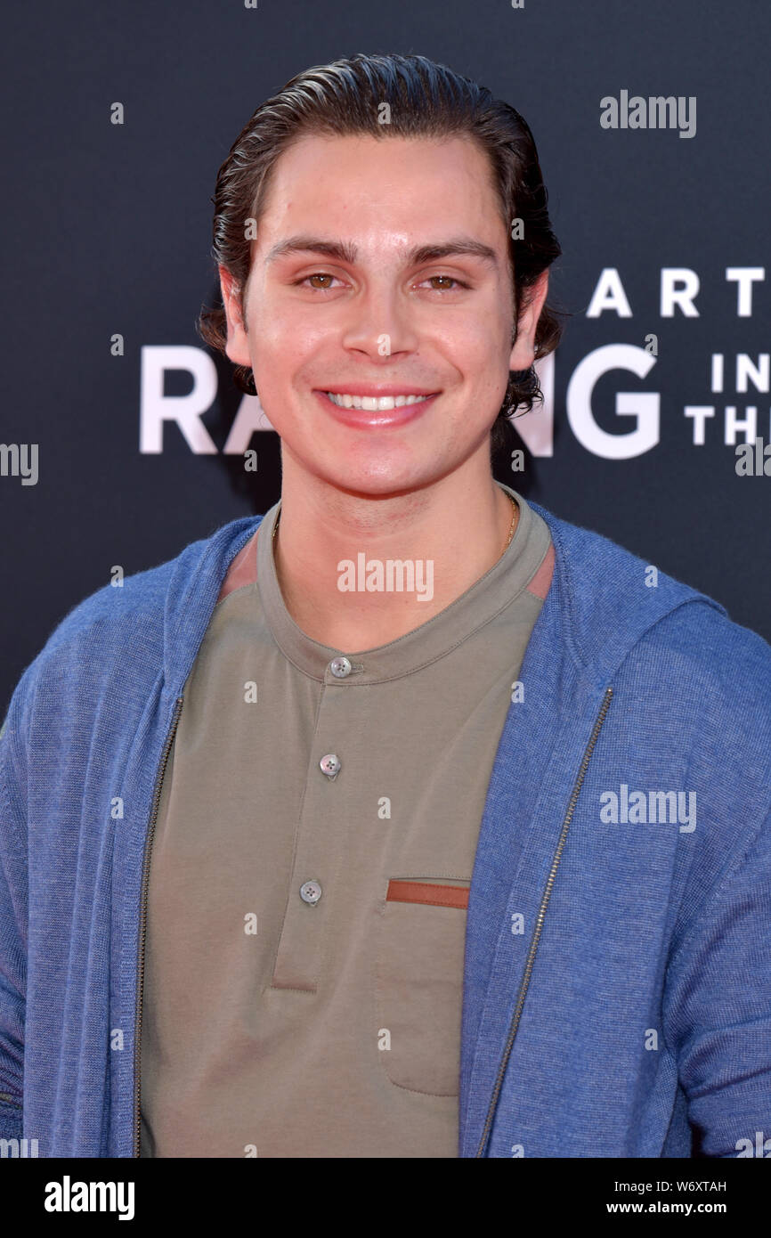 HOLLYWOOD, CA - AUGUST 01: Jake T. Austin arrives for the Premiere Of 20th Century Fox's "The Art Of Racing In The Rain" held at El Capitan Theatre on Stock Photo