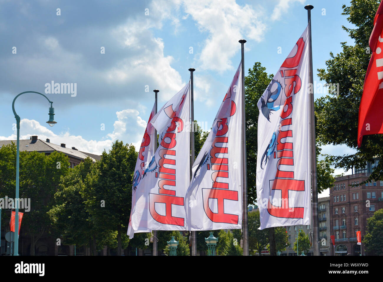Mannheim, Germany - August 2019: Flags with logo of German annual anime and manga convention called 'AnimagiC' in front of entrance Stock Photo