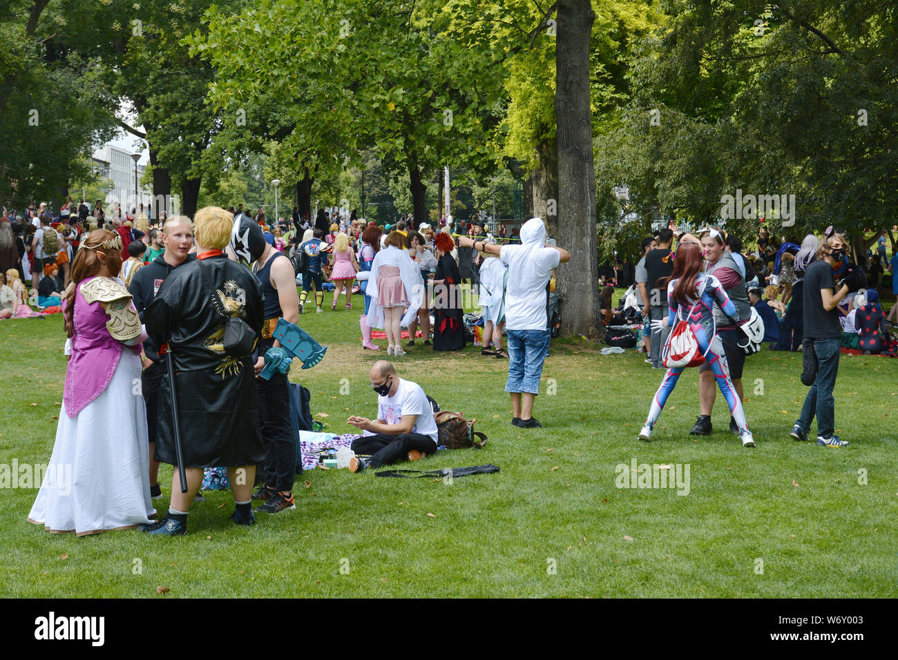 Mannheim, Germany ,  Cosplayers gathering at public park called 'Friedrichsplatz' in Mannheim during anual anime convention Stock Photo