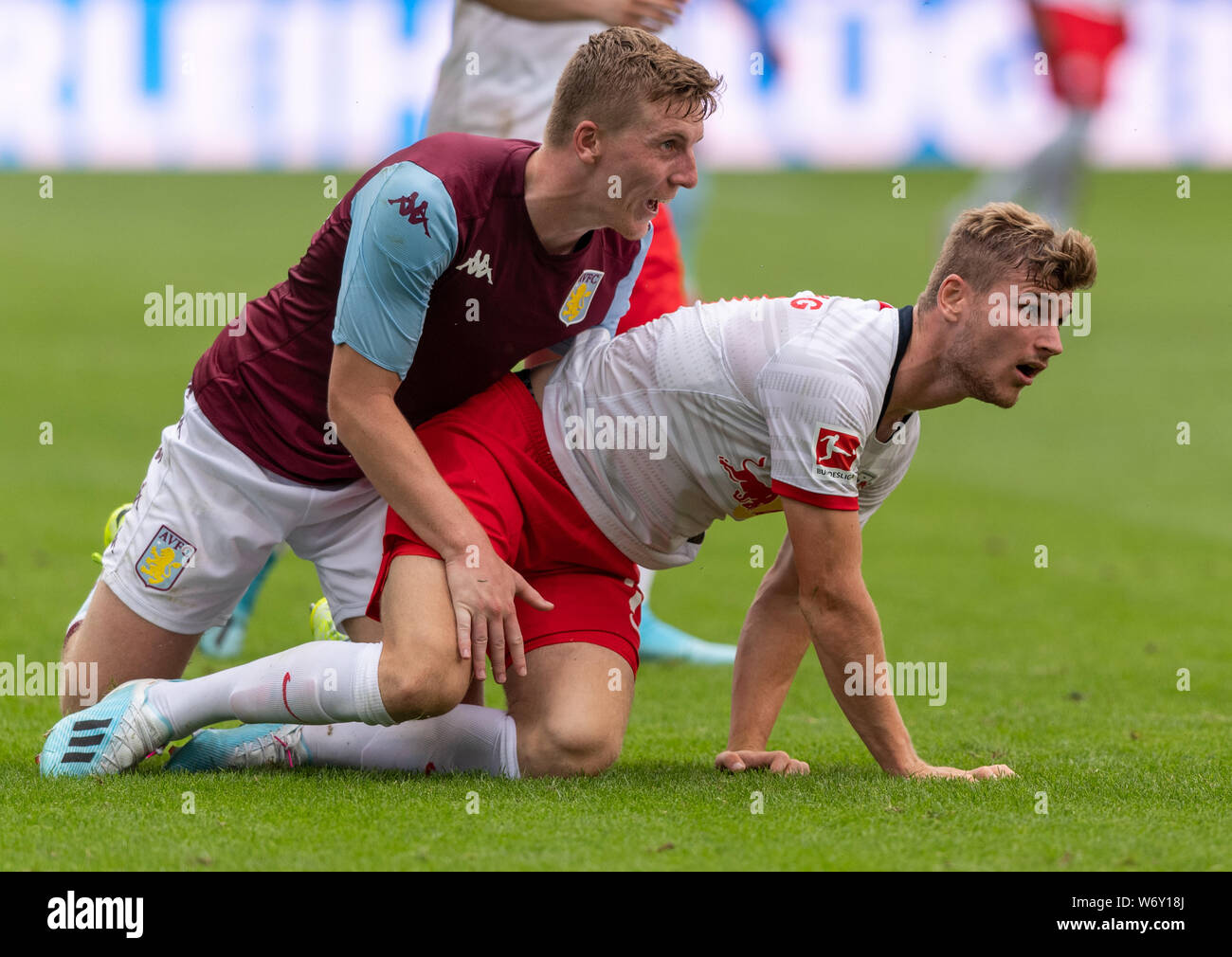 Leipzig, Germany. 03rd Aug, 2019. Soccer: Test match, RB Leipzig - Aston Villa, in the Red Bull Arena in Leipzig. Timo Werner (r) from Leipzig and Matt Targett from Aston Villa are squatting on the floor. Credit: Robert Michael/dpa-Zentralbild/dpa/Alamy Live News Stock Photo