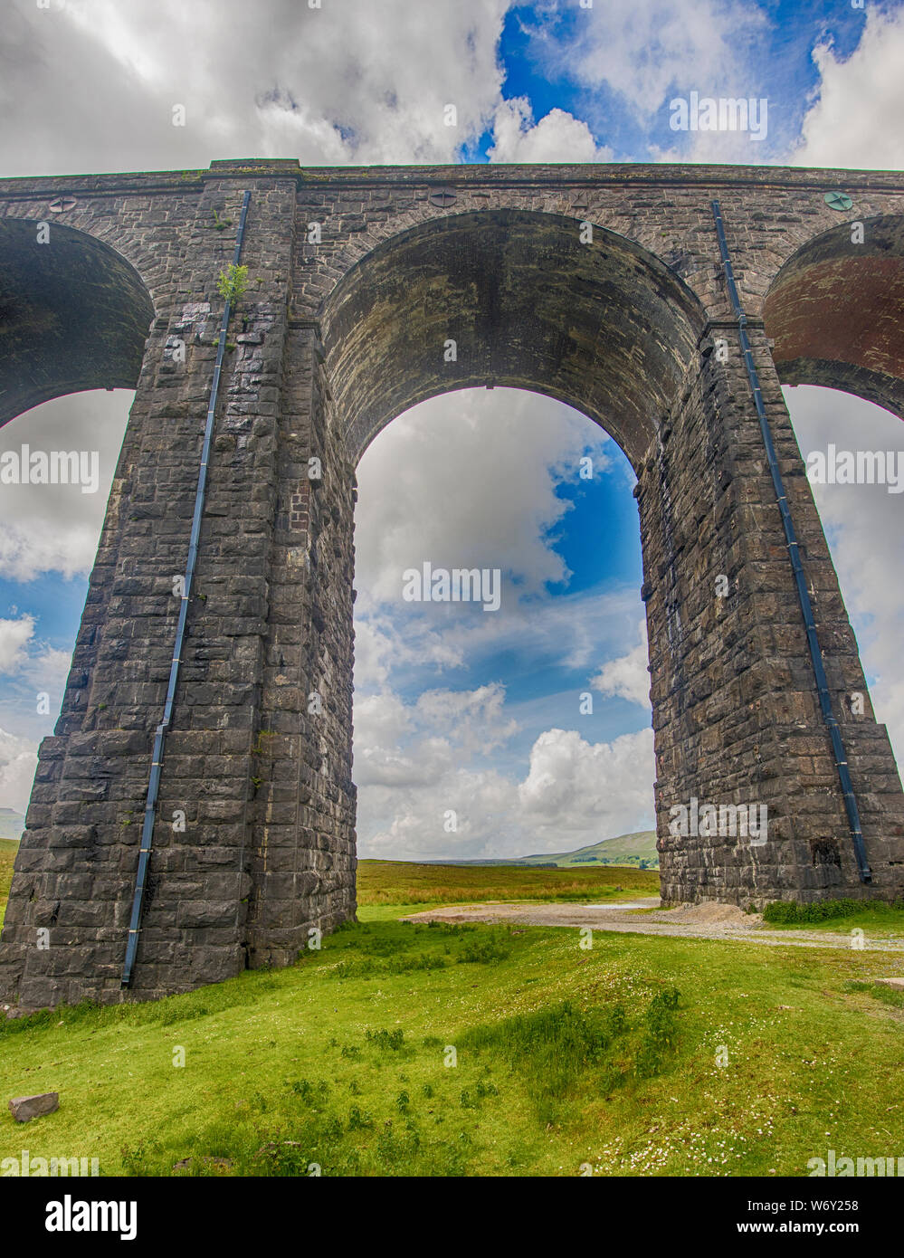 Closeup view of a large old Victorian railway viaduct across valley in rural countryside scenery Stock Photo