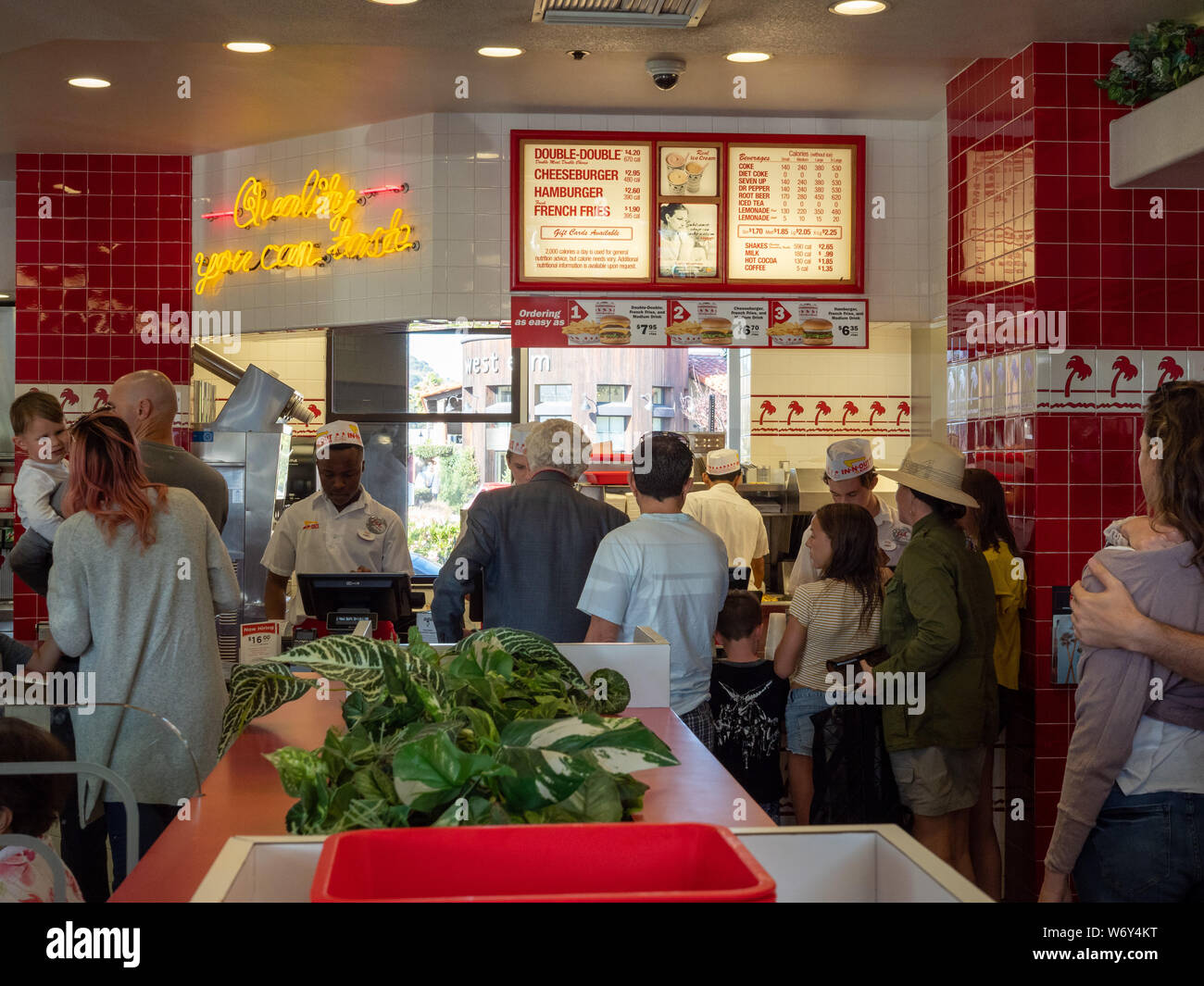 Long line leading to In-N-Out menu and cashier counter Stock Photo