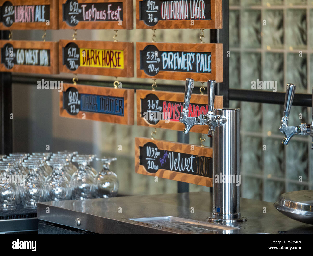 Silver beer taps and types of beer at Anchor Brewing Company Stock