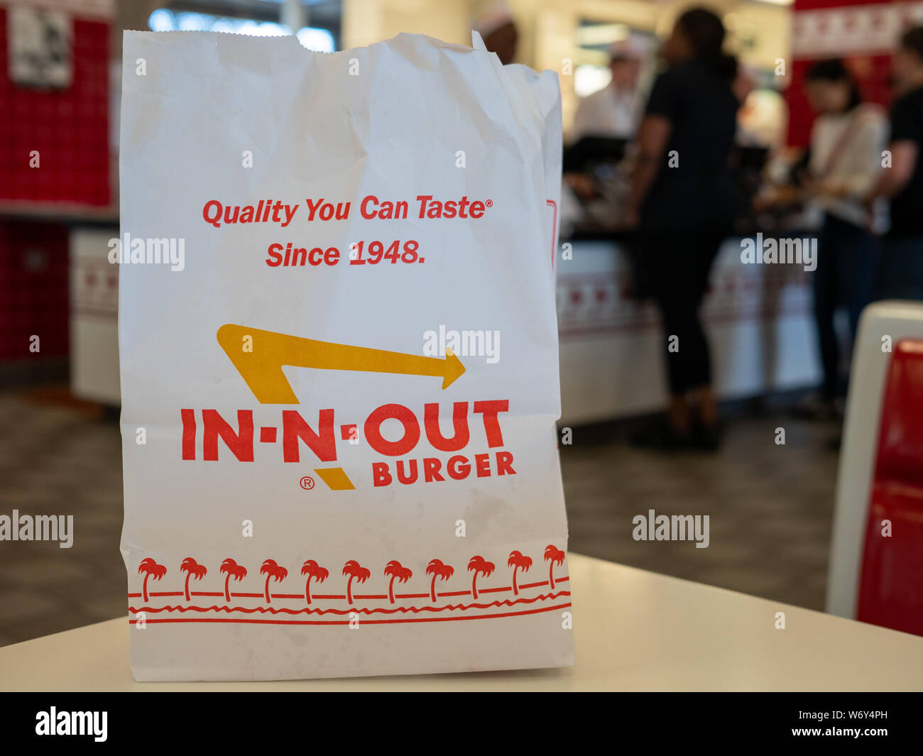 In-n-out Burger chain bag sitting in restaurant location Stock Photo