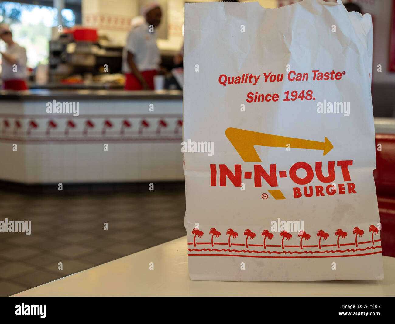In-n-out Burger chain bag sitting in restaurant location. Slogan and logo Stock Photo