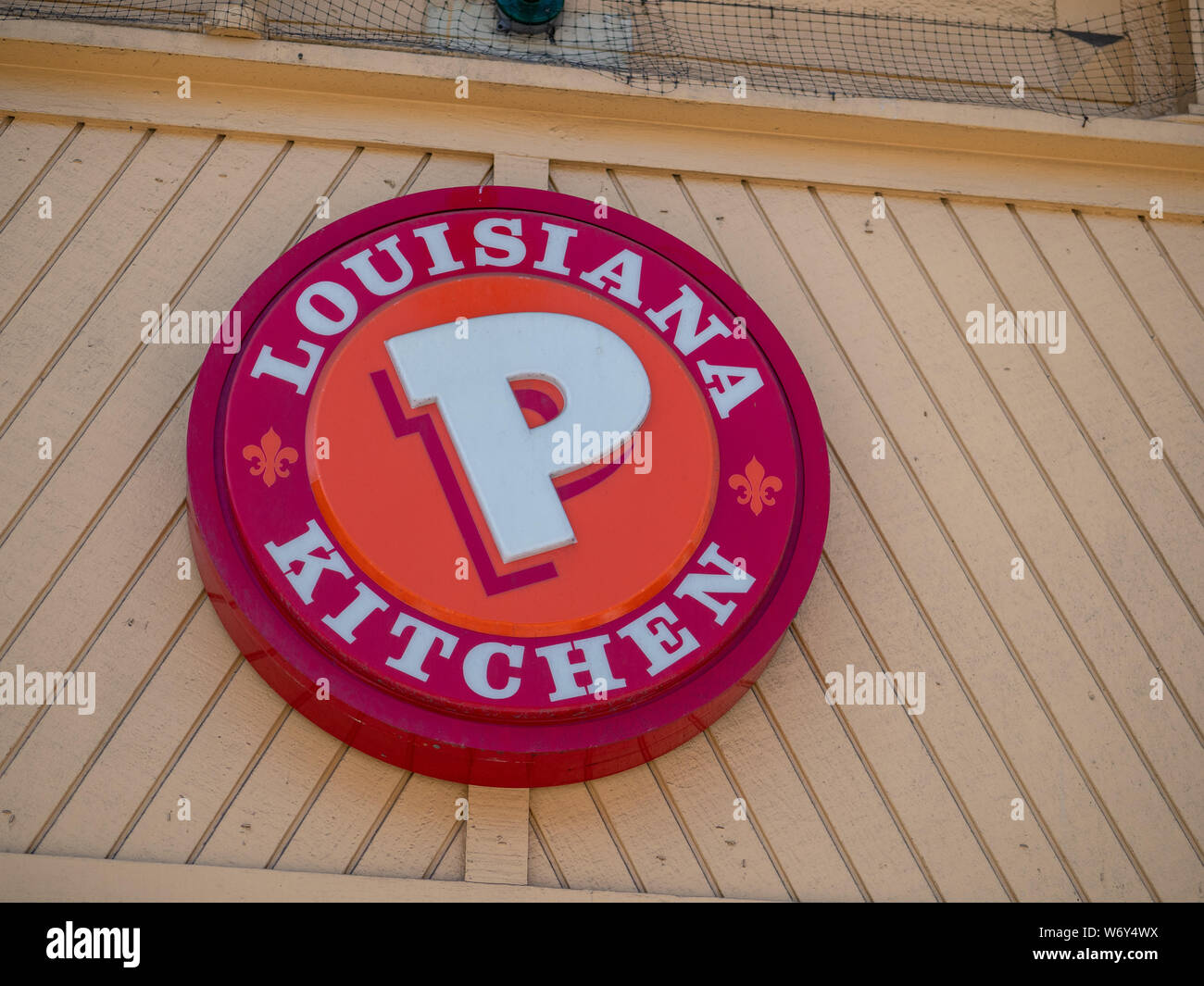 Popeyes Louisiana Chicken fast food restaurant logo on branch location Stock Photo