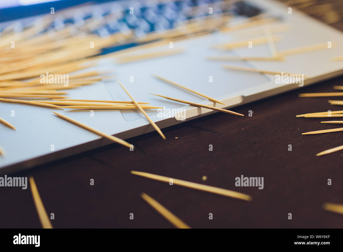 many wooden toothpicks on the brown table background a laptop Stock ...
