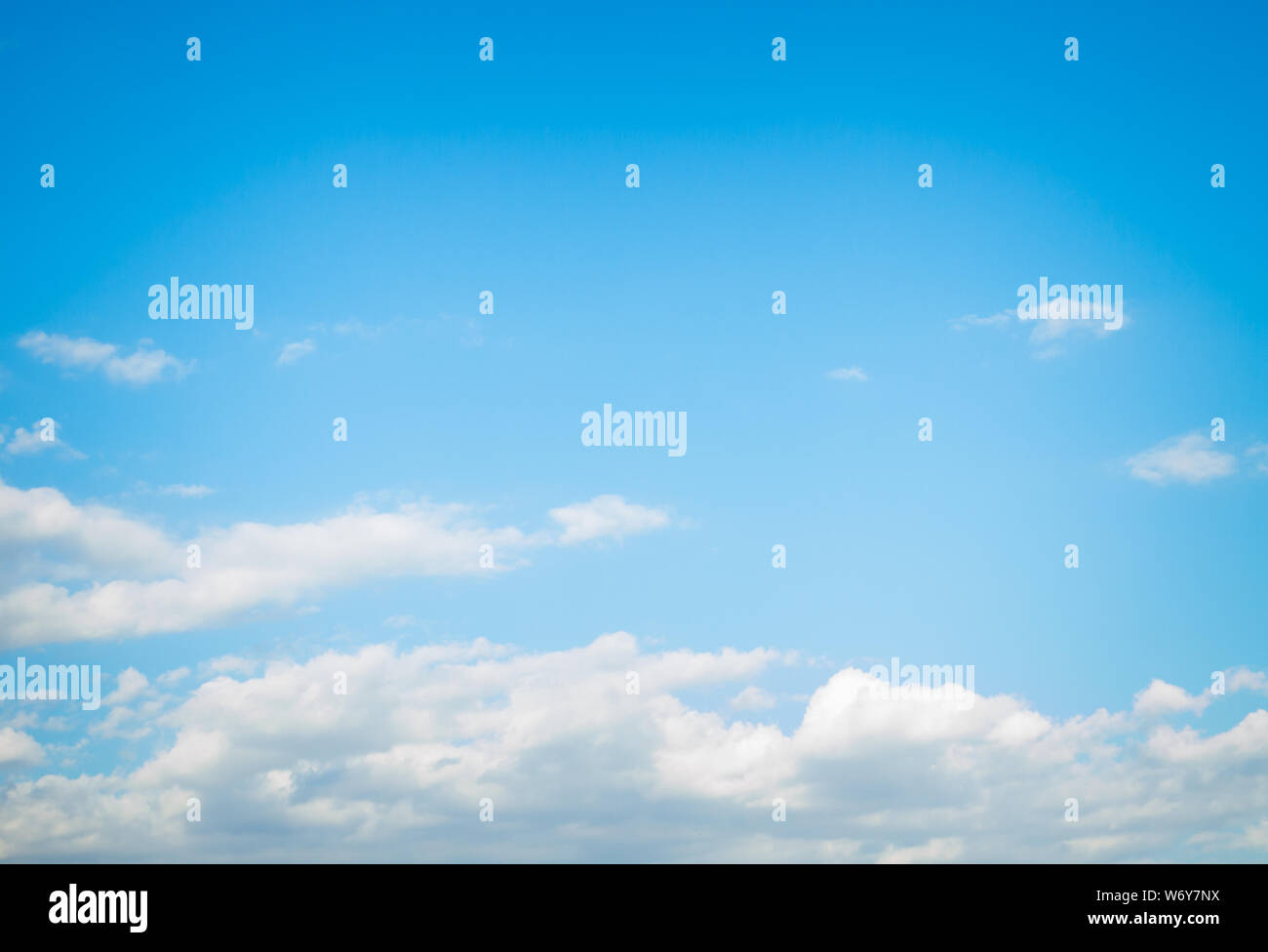 White fluffy clouds in the blue sky in summer Stock Photo - Alamy
