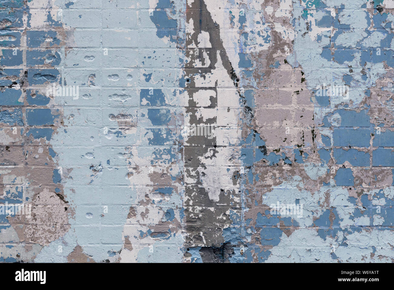 Abstract background of an old brick wall with expressive spots in gray and blue colors. Inimitable pattern Stock Photo