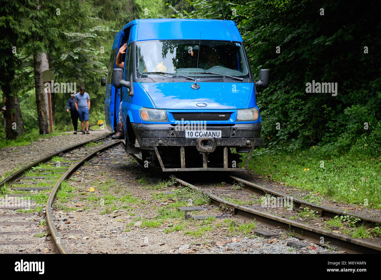 Converted minivan fitted to go on narrow-gauge tracks in Romania as way to faster access to Vaser Valley up to Ukrainian Border Stock Photo