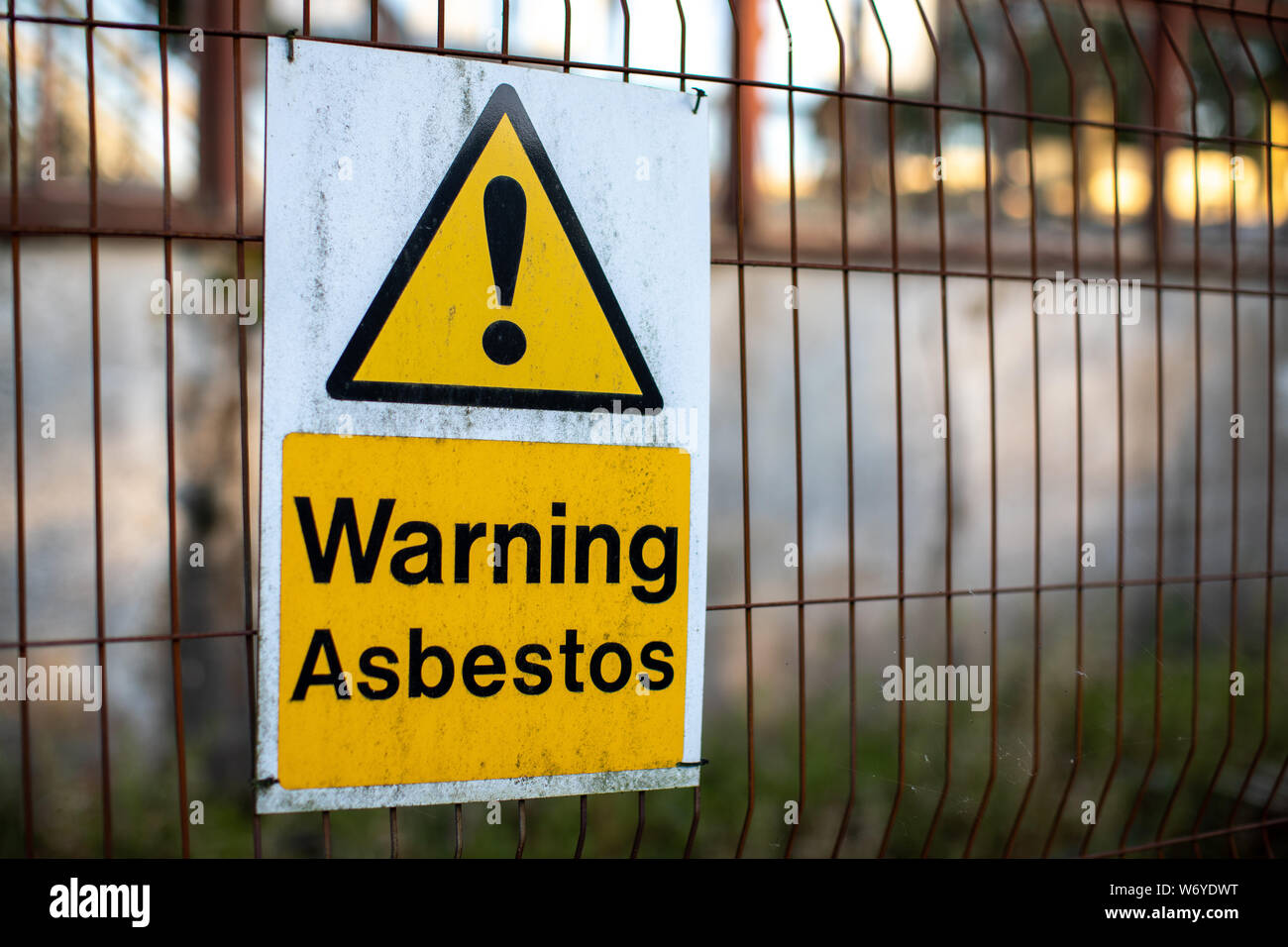 Asbestos warning signs for health and safety on a construction site