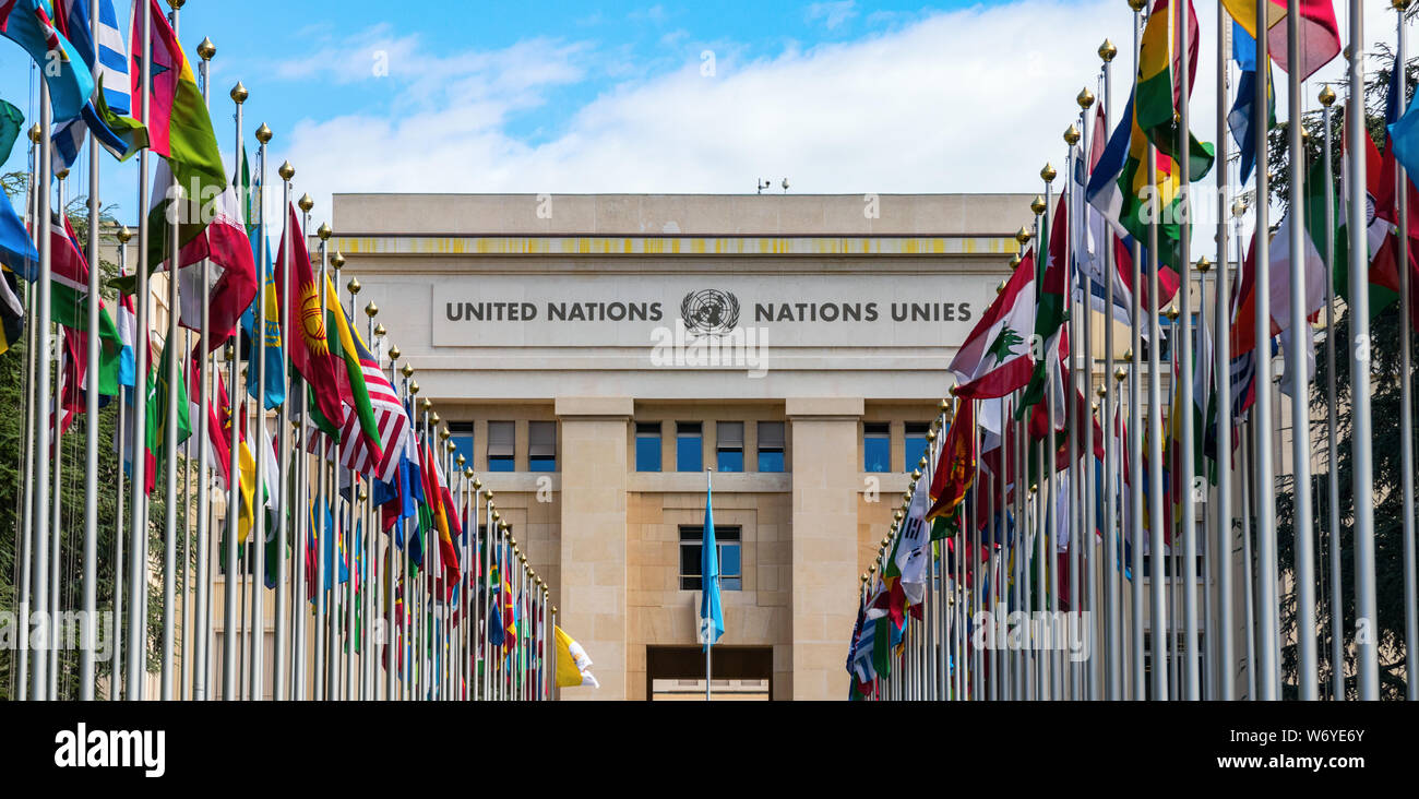 The 'Allee des Nations' (Avenue of Nations) of the Geneva United Nations Palace, with the waving flags of the member countries. Geneva, Switzerland. Stock Photo