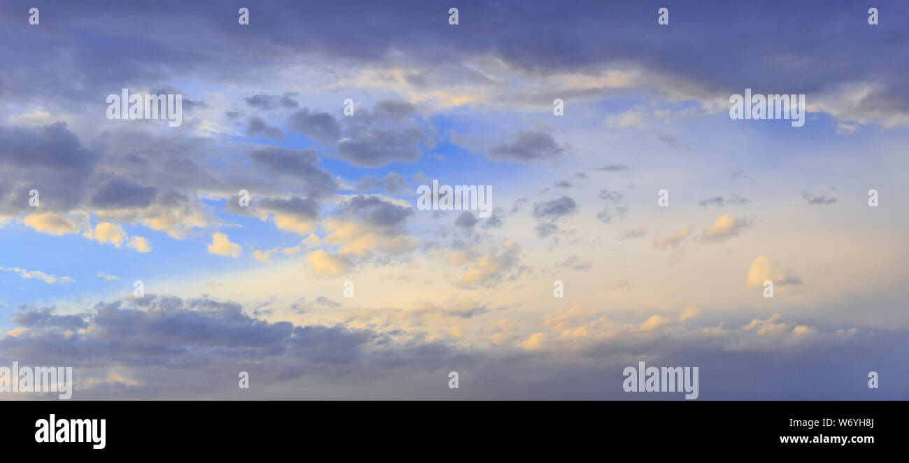 Freedom sky: swirling clouds at dusk. Dreamlike sky with clouds after sunset. Stock Photo