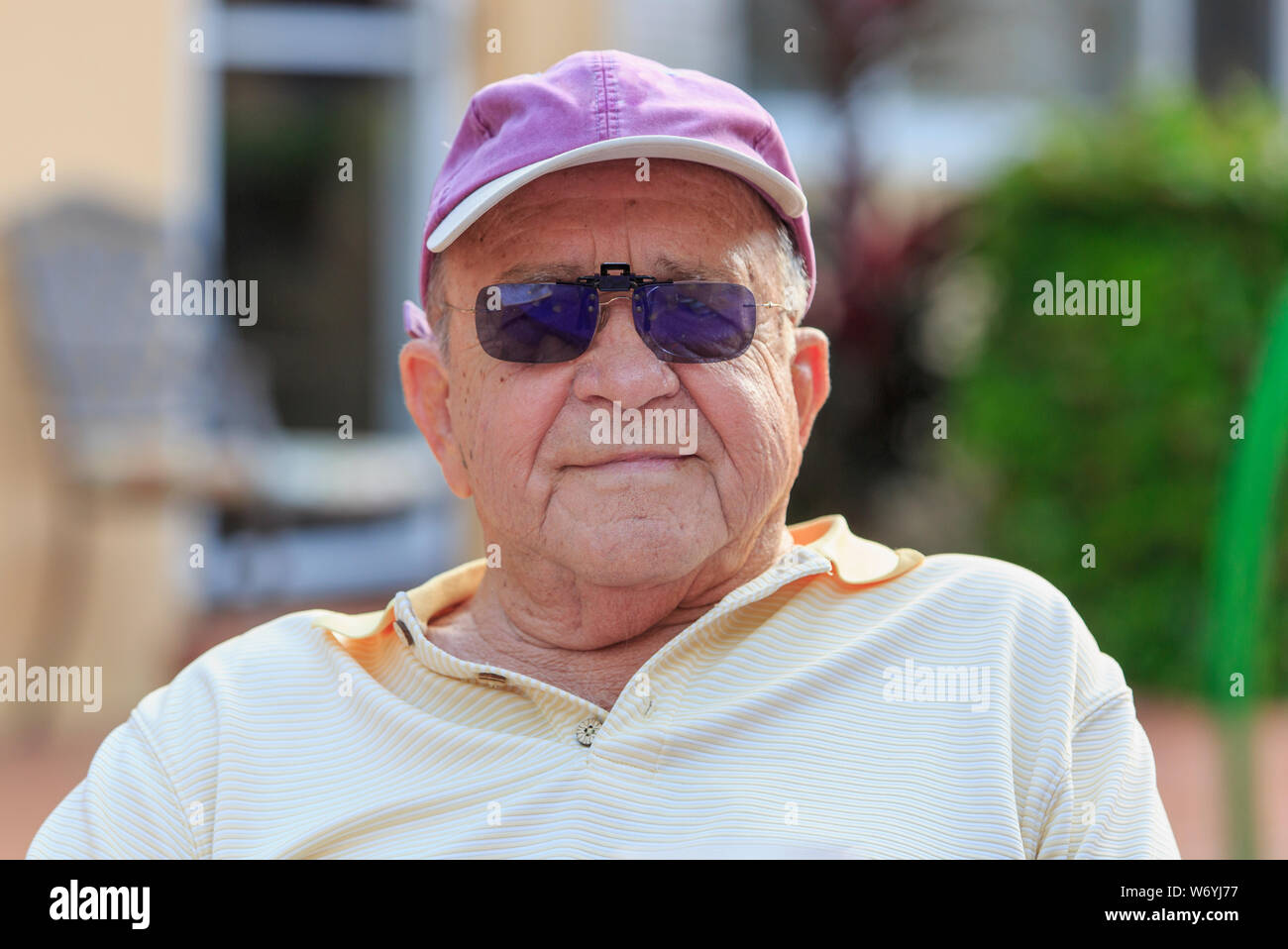Portrait of happy senior man wearing sunglasses Stock Photo