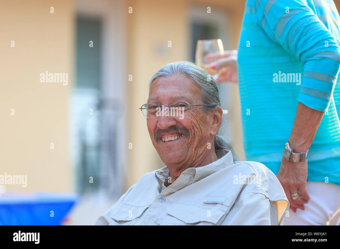 Portrait of happy senior man at a party Stock Photo