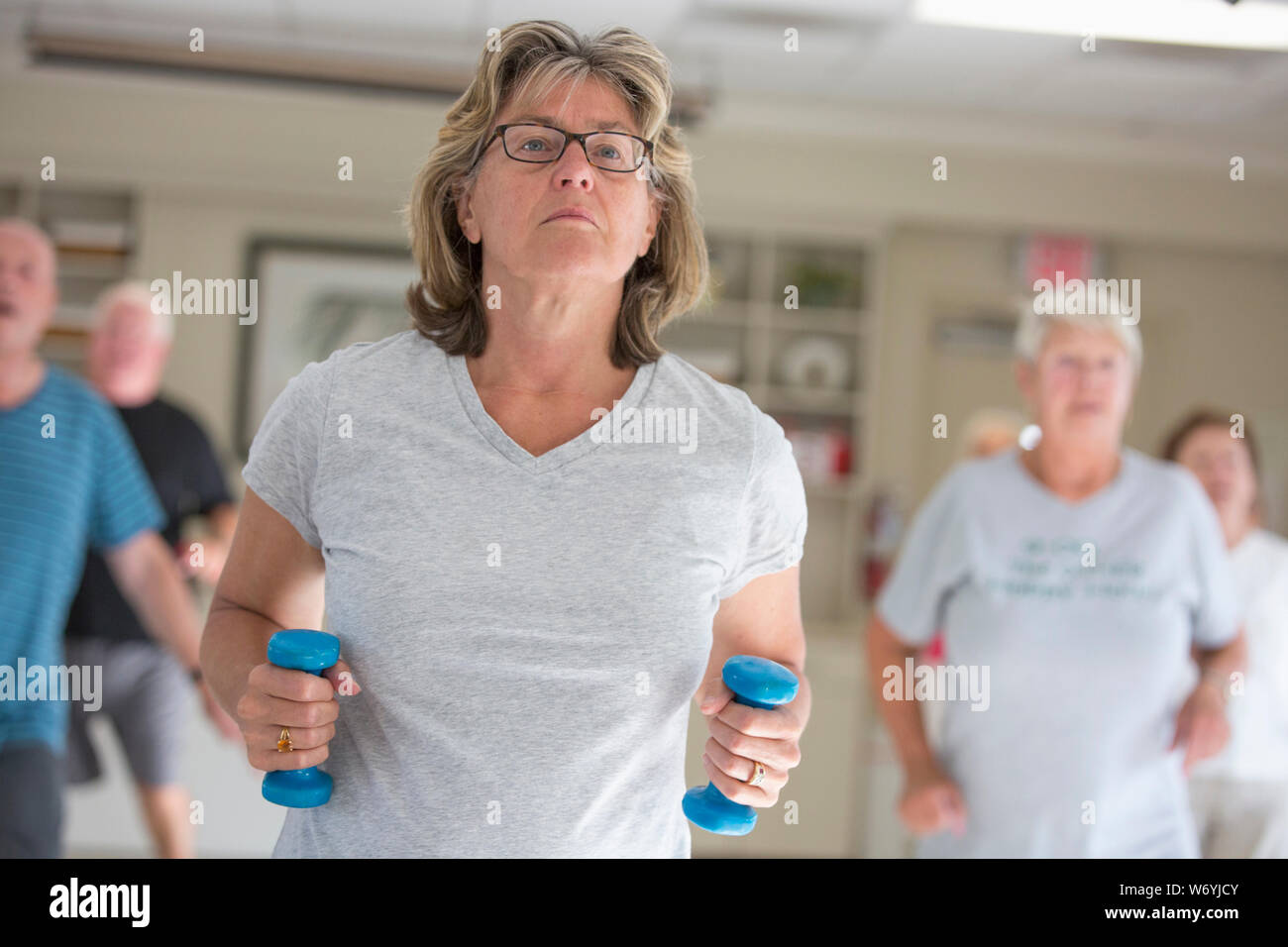 Senior people exercising in gym Stock Photo